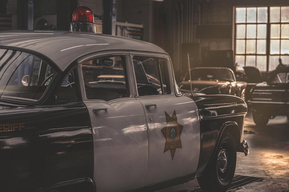 A sheriff’s car parked in a garage
