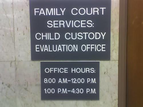 A sign displaying the operating hours of Family Court