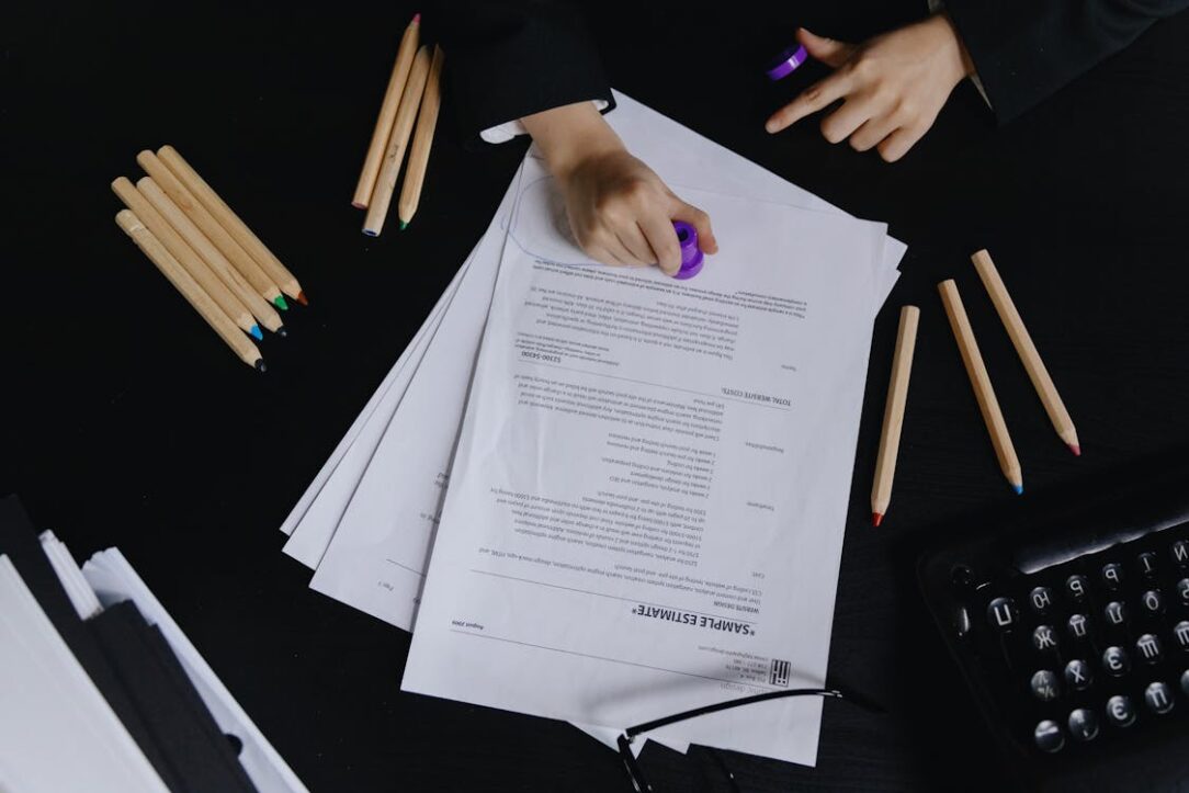 Hands stamping a legal document, symbolizing efficient process serving.